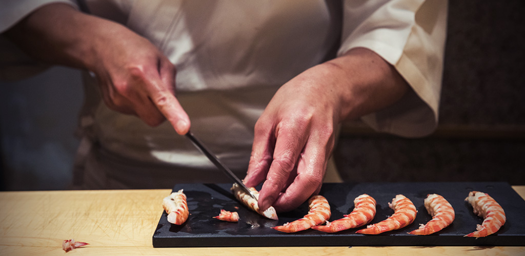 Sushi Saito chef in Tokyo, Japan, preparing sushi